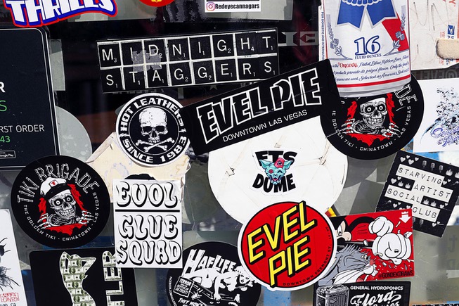 Stickers are shown on the front door of Evel Pie, ...