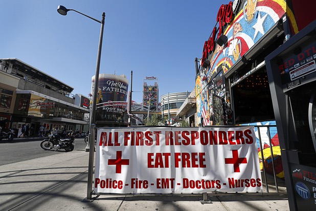 A sign at Evel Pie, 508 E. Fremont St., in downtown Las Vegas Sunday, Oct. 8, 2017. The pizza shop, in collaboration with the Helpful Hoodlums charity group, is donating pizza and drinks to first responders in the wake of the Oct. 1 Route 91 Harvest festival mass shooting.