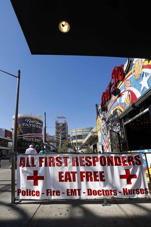 A sign at Evel Pie, 508 E. Fremont St., in downtown Las Vegas Sunday, Oct. 8, 2017. The pizza shop, in collaboration with the Helpful Hoodlums charity group, is donating pizza and drinks to first responders in the wake of the Oct. 1 Route 91 Harvest festival mass shooting.