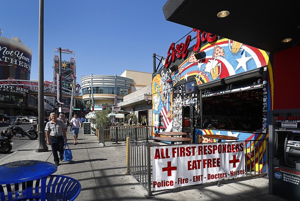 A sign at Evel Pie, 508 E. Fremont St., in downtown Las Vegas Sunday, Oct. 8, 2017. The pizza shop, in collaboration with the Helpful Hoodlums charity group, is donating pizza and drinks to first responders in the wake of the Oct. 1 Route 91 Harvest festival mass shooting.