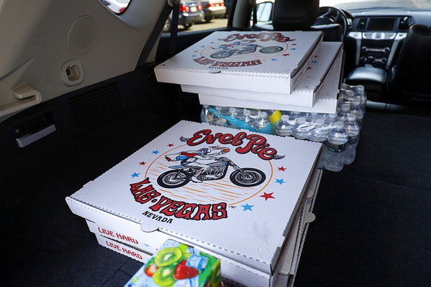 Boxes of Evel Pie pizzas and drinks are shown in a delivery vehicle Sunday, Oct. 8, 2017. The pizza shop, in collaboration with the Helpful Hoodlums charity group, is donating pizza and drinks to first responders in the wake of the Oct. 1 Route 91 Harvest festival mass shooting.
