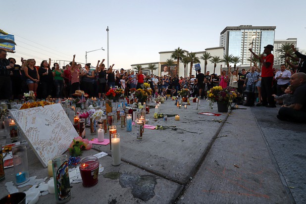 Stretch Sanders (R) of All Shades United speaks during a vigil, marking the one-week anniversary of the Oct. 1 mass shooting, at Sahara Avenue and The Strip Sunday, Oct. 8, 2017.