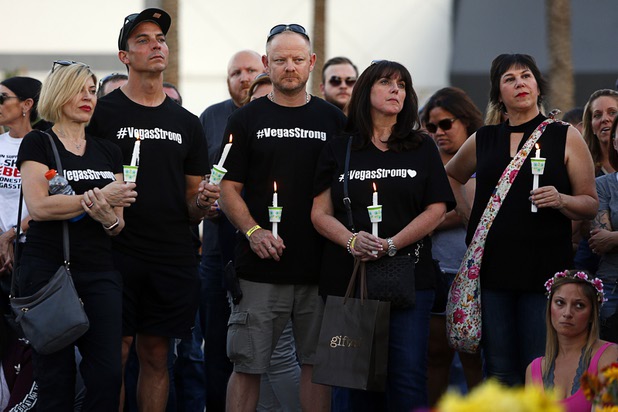 A group with #Vegas Strong T-shirts attend a vigil, marking the one-week anniversary of the Oct. 1 mass shooting, at Sahara Avenue and The Strip Sunday, Oct. 8, 2017.
