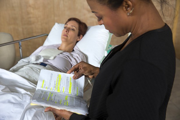 Sabrina Cofield (as nurse Susie Monhahan) looks over her lines during rehearsal for "W;t" at the Public Fit Theatre, 100 South Maryland Parkway, Wednesday Oct. 11, 2017. Tina Rice plays the part of patient Vivian Bearing.