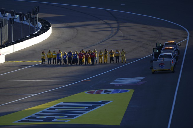 Safety officials stand at attention during the national anthem at the NASCAR Camping World Truck Series Las Vegas 350 Saturday, September 30, 2017, at the Las Vegas Motor Speedway. CREDIT: Sam Morris/Las Vegas News Bureau .