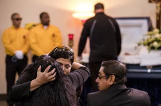 CSC office manager Gina Argento hugs mom Angelica Cervantes at the Davis Funeral Home during a service and burial for Las Vegan Erick Silva, 21, killed in the October 1st mass shooting while working his security job near the stage at Route 91 Harvest festival Thursday, October 12, 2017.