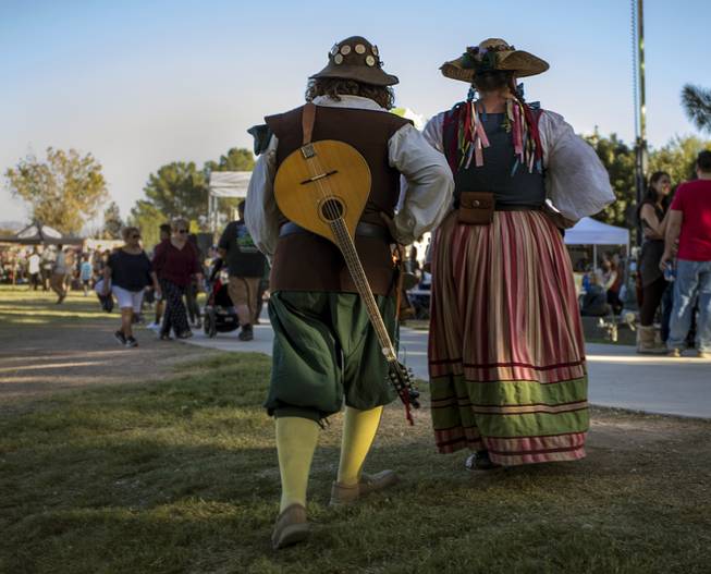 Costumed attendees make their way across the grounds during the Age of Chivalry Renaissance Festival at Sunset Park on Saturday, October 14, 2017.