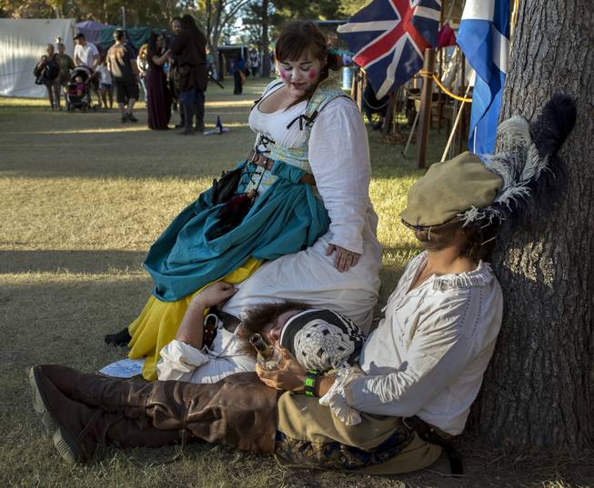 Several drunken members with Company Du Chalis make for a great seat during the Age of Chivalry Renaissance Festival at Sunset Park on Saturday, October 14, 2017.