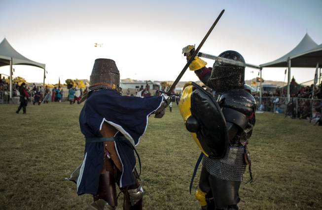 Knights battle for their houses in the Grand Melee on the Field of Honor during the Age of Chivalry Renaissance Festival at Sunset Park on Saturday, October 14, 2017.