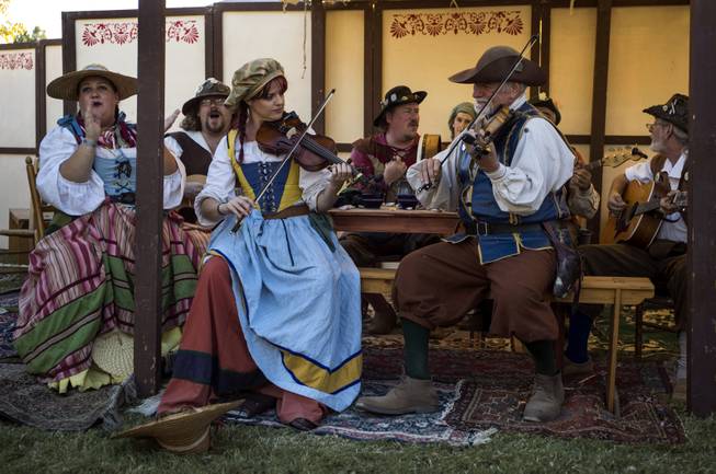 Musicians play and entertain the crowd during the Age of Chivalry Renaissance Festival at Sunset Park on Saturday, October 14, 2017.