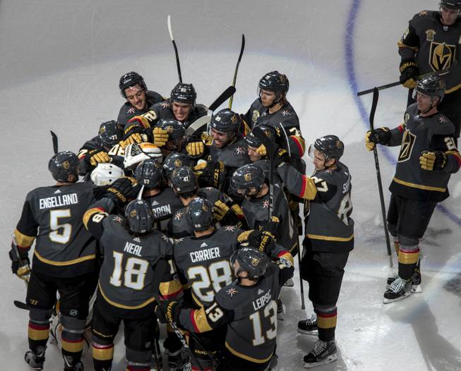 Vegas Golden Knights goalie Malcolm Subban (30) and teammates come together on the ice to celebrate their overtime victory over the Buffalo Sabres 5-4 during their game at the T-Mobile Arena on Tuesday, Oct. 17, 2017.