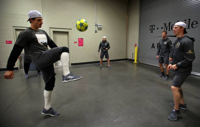 Vegas Golden Knights players and staff warm up with a little soccer as they prepare to face the Buffalo Sabres in the T-Mobile Arena, Tuesday, Oct. 17, 2017.