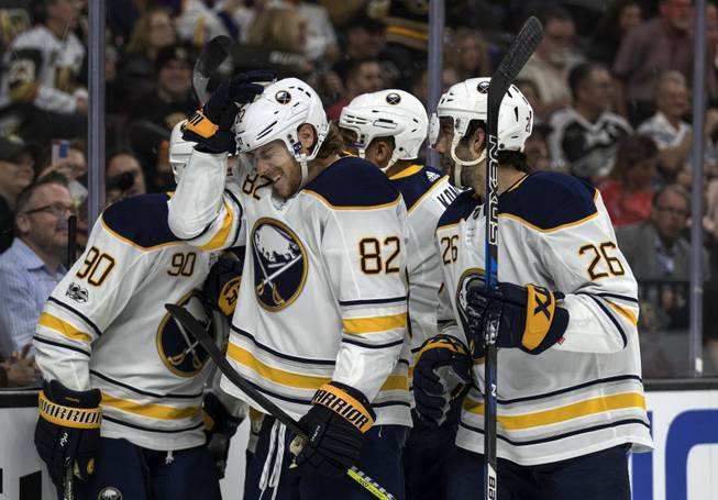 Buffalo Sabres defenseman Nathan Beaulieu (82) and teammates celebrate their first goal of the night over the Vegas Golden Knights during their game at the T-Mobile Arena on Tuesday, Oct. 17, 2017.