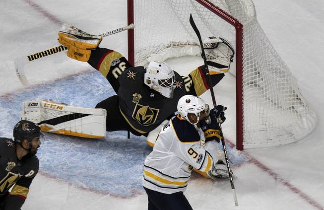 Vegas Golden Knights goalie Malcolm Subban (30) stretches out defending the goal from the Buffalo Sabres left wing Evander Kane (9) during their game at the T-Mobile Arena on Tuesday, Oct. 17, 2017.