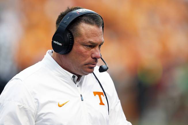 Tennessee head coach Butch Jones walks to the sideline in the second half of an NCAA college football game against Georgia Saturday, Sept. 30, 2017, in Knoxville, Tenn. Georgia won 41-0. 