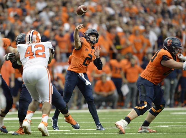 Syracuse quarterback Eric Dungey (2) throws a pass during the second half of an NCAA college football game against Clemson, Friday, Oct. 13, 2017, in Syracuse, N.Y. Syracuse upset No. 2 Clemson, 27-24. 