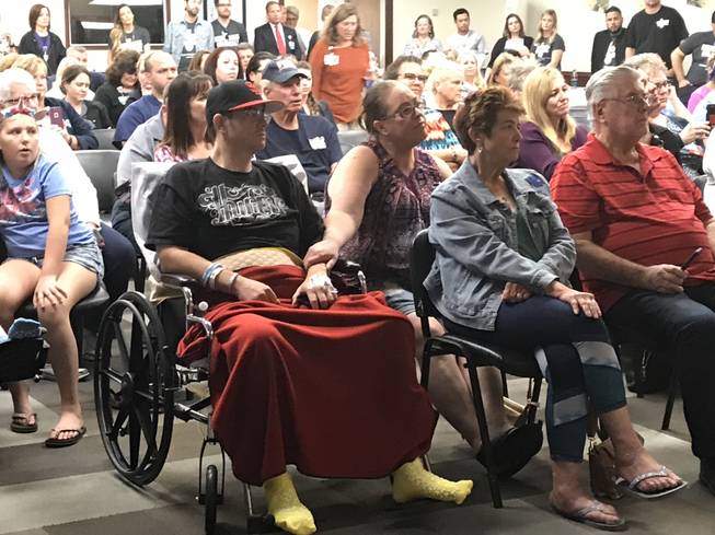 Michael Caster and his girlfriend, Tawny Temple, attend a special music set by Michael Ray at Sunrise Hospital on Oct. 11. Caster was shot in the back during the Route 91 Harvest Festival shooting, leaving him paralyzed from the waist down. 