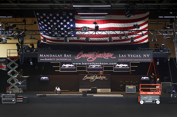 Works ready the auction stage before the 10th annual Barrett-Jackson Las Vegas classic car auction at the Mandalay Bay Convention Center Wednesday, Oct. 18, 2017. The three-day auction begins Thursday.