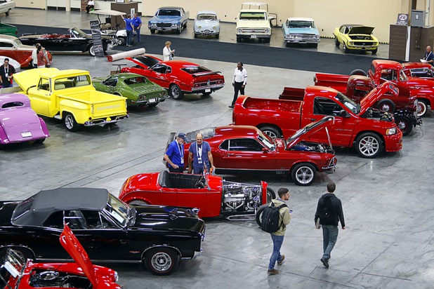 People look over some of the almost 700 vehicles at the 10th annual Barrett-Jackson Las Vegas classic car auction in the Mandalay Bay Convention Center Wednesday, Oct. 18, 2017. The three-day auction begins Thursday.