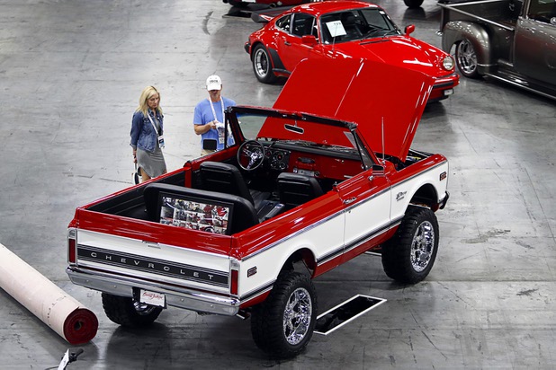 A couple looks over a topless 1972 Chevrolet K5 4X4 Blazer before the 10th annual Barrett-Jackson Las Vegas classic car auction at the Mandalay Bay Convention Center Wednesday, Oct. 18, 2017. The three-day auction begins Thursday.