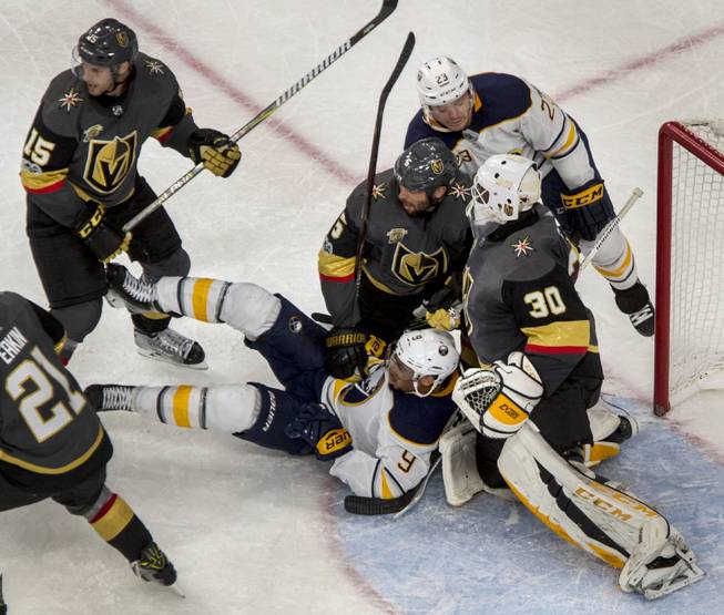 The Vegas Golden Knights battle with the Buffalo Sabres in overtime during their game at the T-Mobile Arena on Tuesday, Oct. 17, 2017.