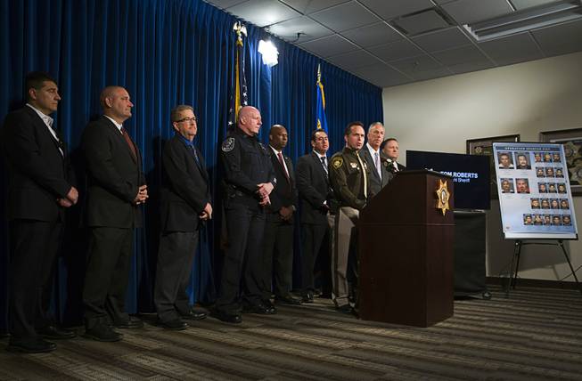 Las Vegas Metro Assistant Sheriff Tom Roberts is joined by representatives from law enforcement partners as he discusses the indictment of over 20 gang members during a news conference at Metro Police headquarters Thursday, Oct. 19, 2017.