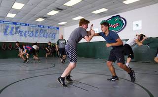 Freshman wrestlers Caleb Breckenridge, left and Davis Ainslie practice at Green Valley High School Thursday, Oct. 19, 2017.