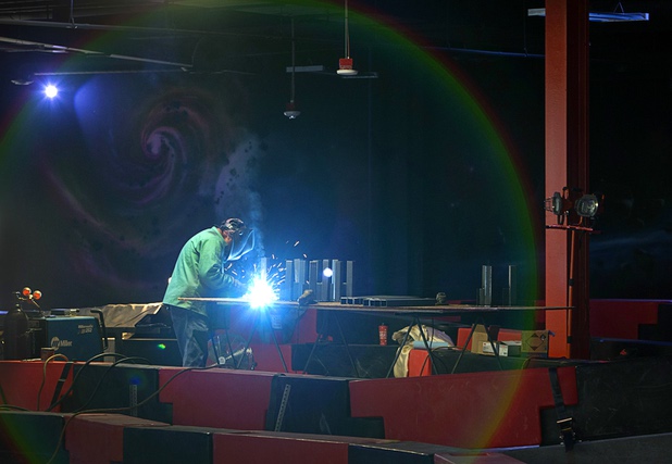 A welder works at a bumper car course at the Rex Center, a family fun center under construction, in the Boulevard Mall Wednesday, Oct. 25, 2017.