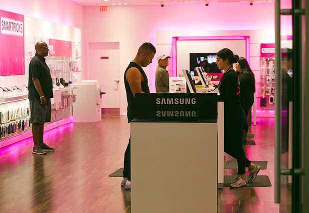 Shoppers are shown at a T-Mobile store in the Boulevard Mall Wednesday, Oct. 25, 2017.