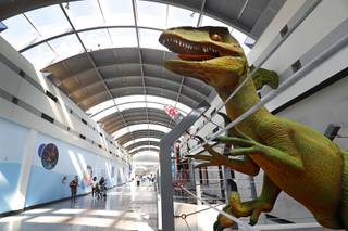 A dinosaur statue is shown at the Rex Center, a family fun center under construction, in the Boulevard Mall Wednesday, Oct. 25, 2017.
