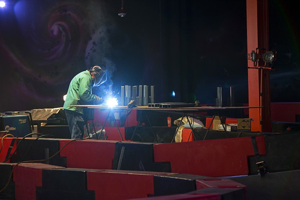 A welder works on a bumper car course in the Rex Center, a family fun center under construction, in the Boulevard Mall Wednesday, Oct. 25, 2017.