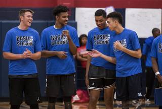 Players shares laugh during a showcase high school basketball game at Halloween Hoops comprised of the city's top players at Coronado High School on Saturday, Oct. 28, 2017.  L.E. Baskow.