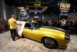 Ring Brothers Mike, left, and Jim Ring, unveil a supercharged 1972 AMC Javelin, created for Prestone's 90th anniversary, during the 2017 Specialty Equipment Market Association (SEMA) show at the Las Vegas Convention Center Tuesday, Oct. 31, 2017.  STEVE MARCUS