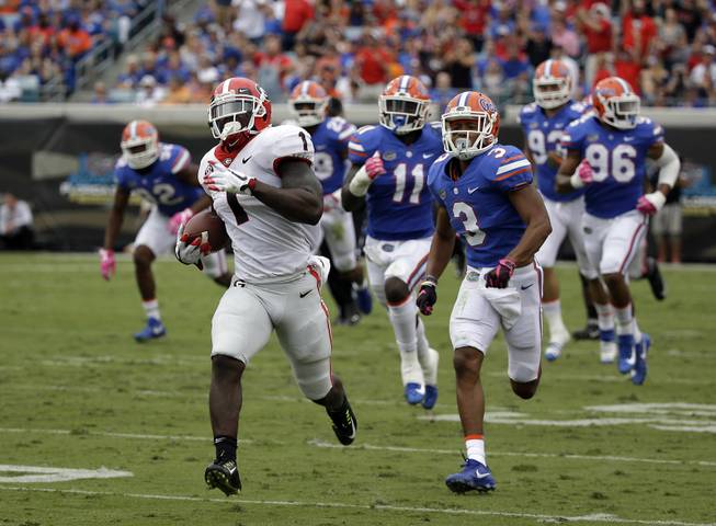 Georgia running back Sony Michel (1) runs a 74-yard touchdown against Florida in the first half of an NCAA college football game, Saturday, Oct. 28, 2017, in Jacksonville, Fla. (AP Photo/John Raoux)