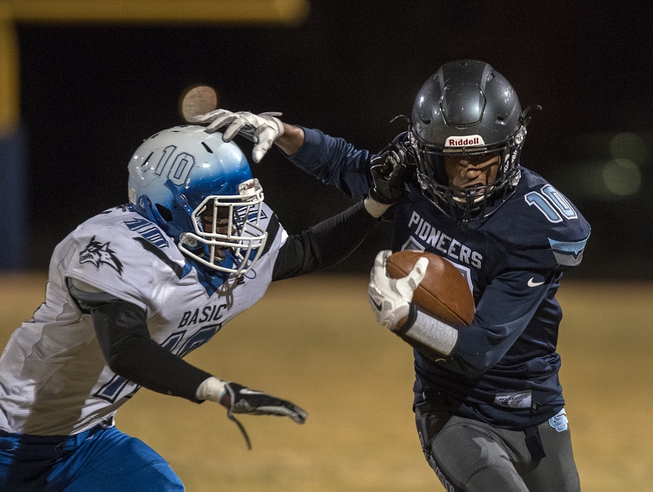Basic's Franco Mays Jr. (10) attempts to tackle Canyon Springs' ...