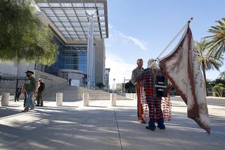 Supporters of rancher Cliven Bundy and his family are shown outside the federal courthouse in downtown Las Vegas Tuesday, Nov. 7, 2017. The trial of rancher Cliven Bundy, two of his sons, and Ryan Payne was postponed for a week.