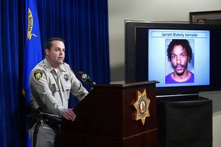 Metro Police Deputy Chief Chris Jones speaks during a news conference at Metro Police Headquarters Thursday, Nov. 9, 2017. A photo of Jarrett Blakely Varnado is shown on a monitor at right.