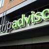 The company logo for the travel website TripAdvisor hangs at the company's headquarters, Thursday, Nov. 2, 2017, in Needham, Mass. 