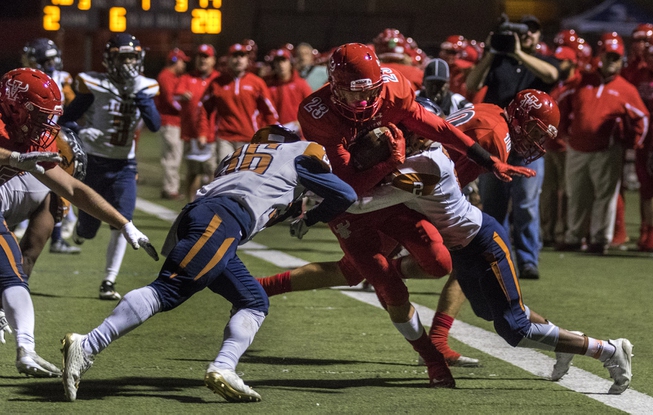 Arbor View's Deago Stubbs (23) is stopped by Legacy's Amorey ...