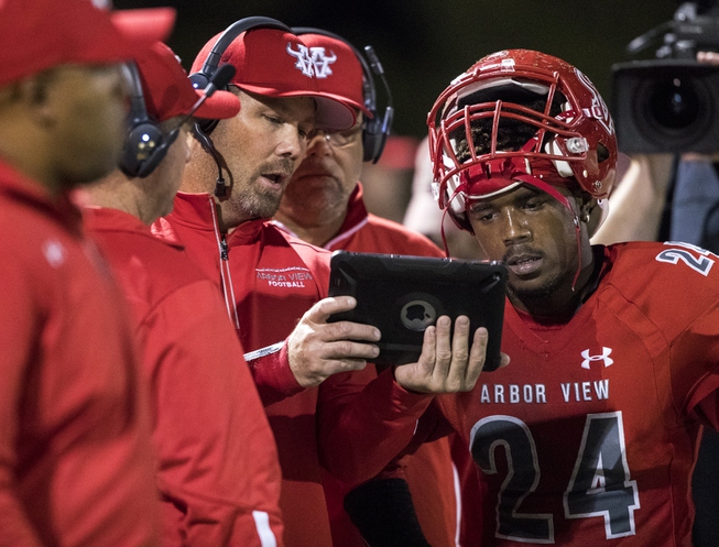 Arbor View's Rodney Pitts (24) confers with coaches along the ...