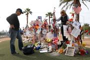 Chris and Debbie Davis, parents of Route 91 shooting victim Neysa Tonks visit her cross before a cross-moving ceremony by the 