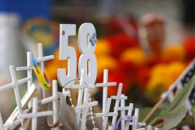 A display honors the 58 victims of the Route 91 mass shooting near the “Welcome to Las Vegas” sign on Las Vegas Boulevard South Sunday, Nov. 12, 2017.