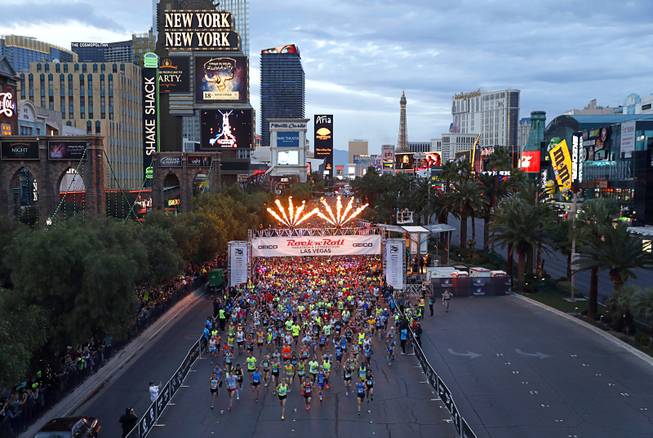 The first wave of runners head southbound on the Las ...