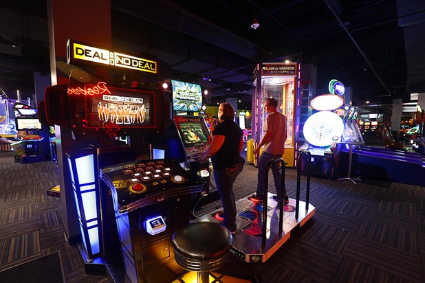Brittany and James Stewart of Dallas, Texas play a "Dance Dance Revolution SuperNova" game at GameWorks in Town Square Las Vegas Monday, Nov. 13, 2017.