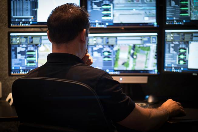 A dispatcher is shown in this photo provided by ShotSpotter.