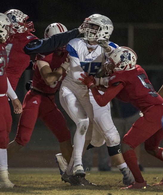 Green Valley's Adrian Gutierrez (85) is tackled by Liberty defenders ...