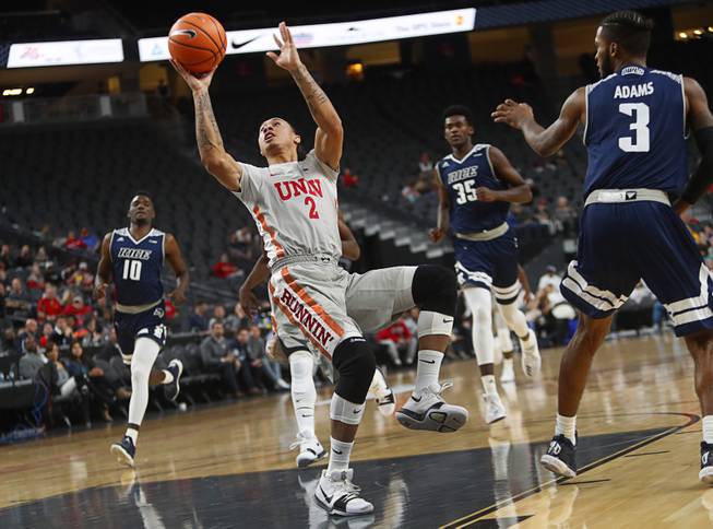 UNLV's Anthony Smith (2) takes a shot in a game against the Rice Owls during the MGM International Main Event basketball tournament at T-Mobile Monday, Nov. 20, 2017.