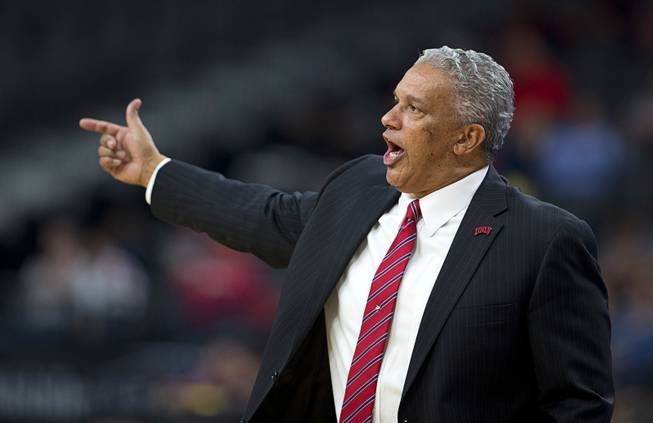 UNLV head coach Marvin Menzies calls out to players during a game against the Rice Owls in the MGM International Main Event basketball tournament at T-Mobile Monday, Nov. 20, 2017.