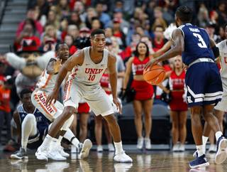 UNLV's Shakur Juiston (10) guards Rice's Ako Adams (3) during the MGM International Main Event basketball tournament at T-Mobile Monday, Nov. 20, 2017.