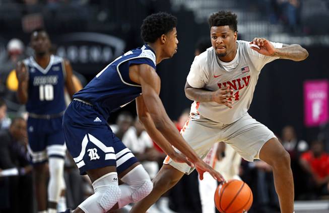 UNLV's Tervell Beck (14) guards Rice's Malik Osborne (13) in a game against the Rice Owls during the MGM International Main Event basketball tournament at T-Mobile Monday, Nov. 20, 2017.